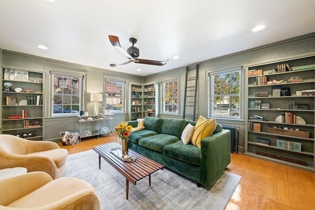 46 Church St, Dedham, MA 02026 - sitting room featuring a healthy amount of sunlight, ceiling fan, ornamental molding, and wood finished floors