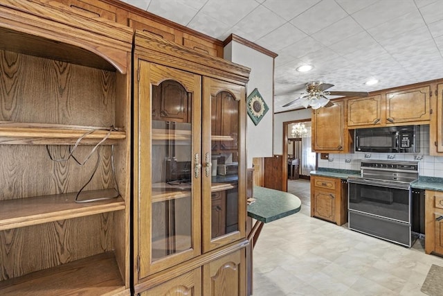 kitchen with decorative backsplash, electric range oven, and ceiling fan