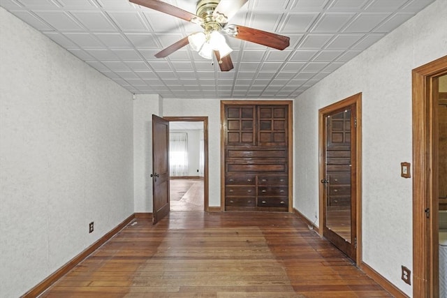 interior space with hardwood / wood-style flooring and ceiling fan