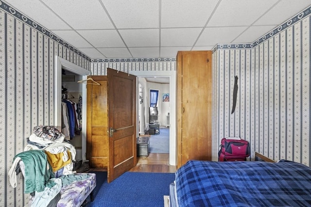 bedroom with a closet and a drop ceiling