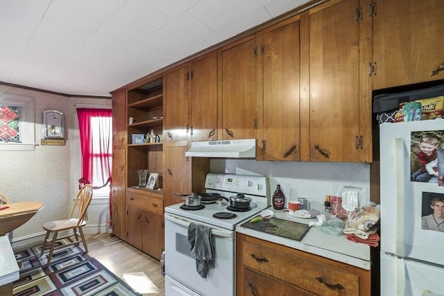 kitchen featuring white appliances and light wood-type flooring