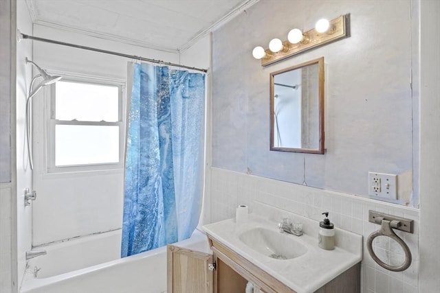 bathroom featuring vanity, shower / tub combo with curtain, tile walls, and crown molding