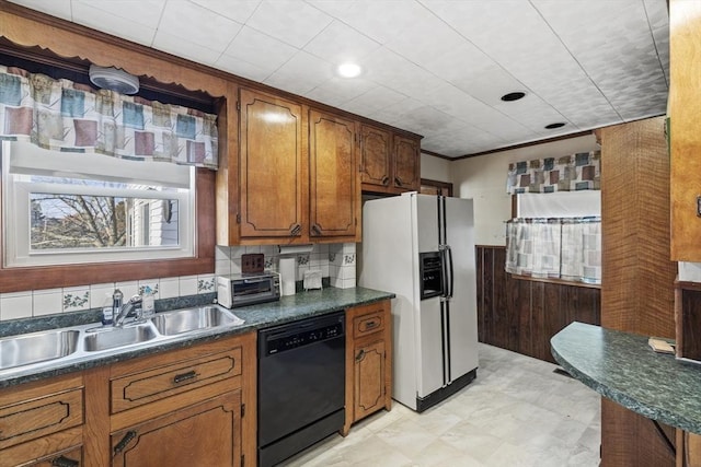 kitchen featuring white refrigerator with ice dispenser, black dishwasher, ornamental molding, and sink