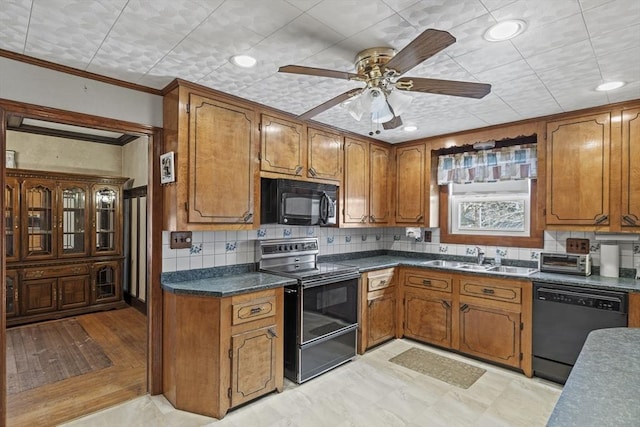 kitchen with black appliances, crown molding, sink, ceiling fan, and decorative backsplash