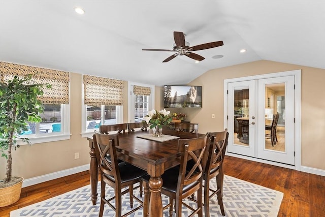 dining area with lofted ceiling, wood-type flooring, baseboards, and french doors