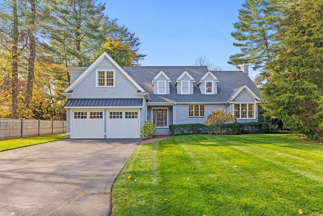 view of front facade with a garage and a front yard