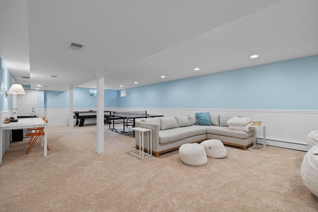 carpeted living room featuring a baseboard radiator