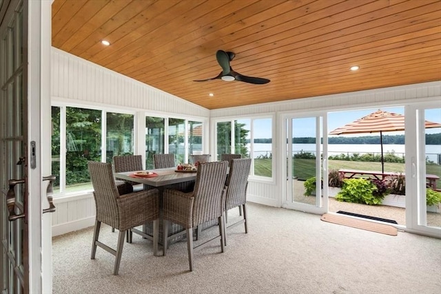 sunroom with vaulted ceiling, a water view, wooden ceiling, and ceiling fan