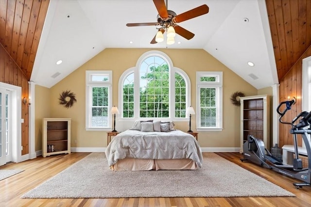 bedroom with vaulted ceiling, ceiling fan, light hardwood / wood-style floors, and ornate columns