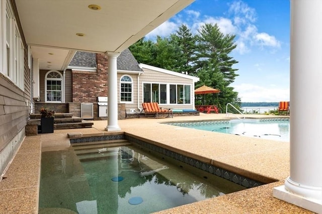 view of swimming pool with a patio area