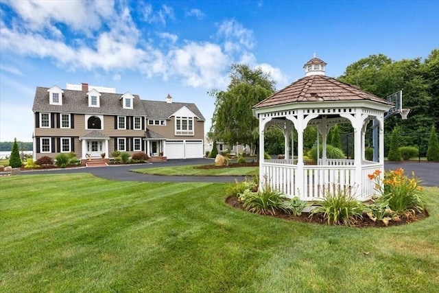 surrounding community featuring a gazebo and a lawn