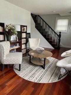 living area with hardwood / wood-style floors