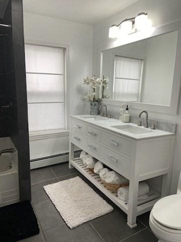 bathroom featuring vanity, a baseboard radiator, tile patterned floors, and toilet