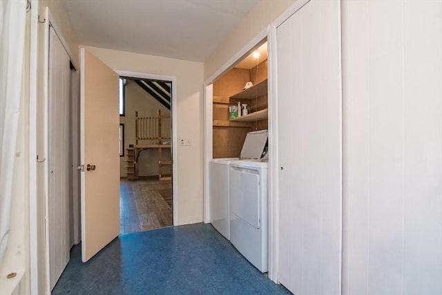 washroom featuring separate washer and dryer and laundry area