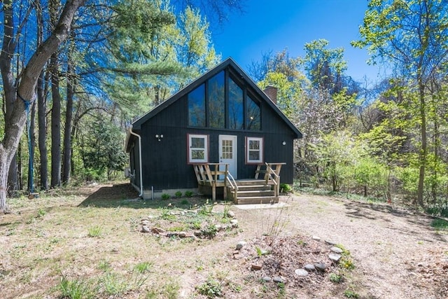 rustic home featuring a chimney