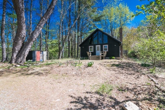view of front of home featuring a chimney
