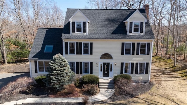 view of front of property featuring roof with shingles