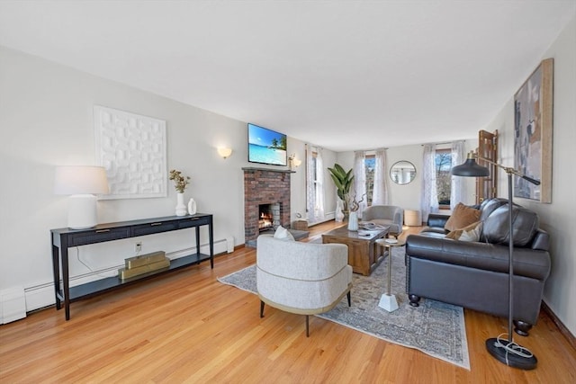 living room featuring wood finished floors and a fireplace