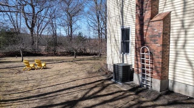 view of yard featuring central AC unit