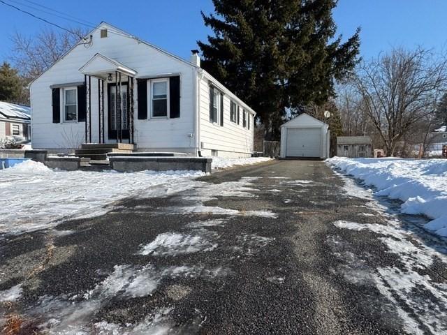 view of front of house featuring an outbuilding and a garage