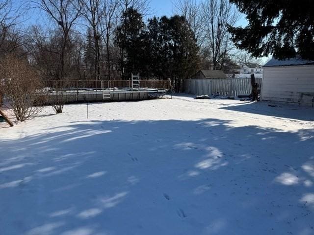 view of yard layered in snow