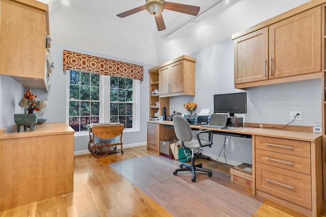 office space featuring lofted ceiling, track lighting, ceiling fan, and light wood-type flooring