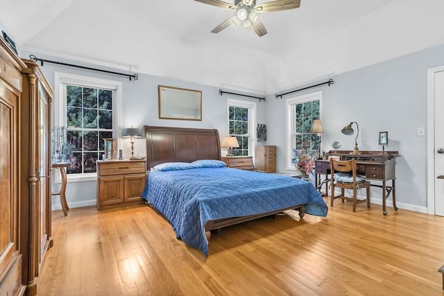 bedroom featuring lofted ceiling, light wood-type flooring, and ceiling fan