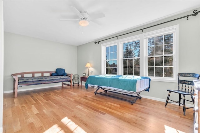 bedroom with ceiling fan and hardwood / wood-style flooring