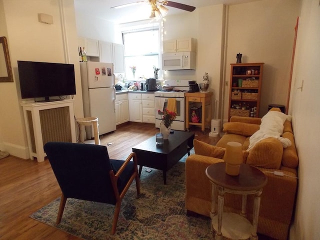 514 Harvard St Unit 2D, Brookline, MA 02446 - living area with wood finished floors and ceiling fan