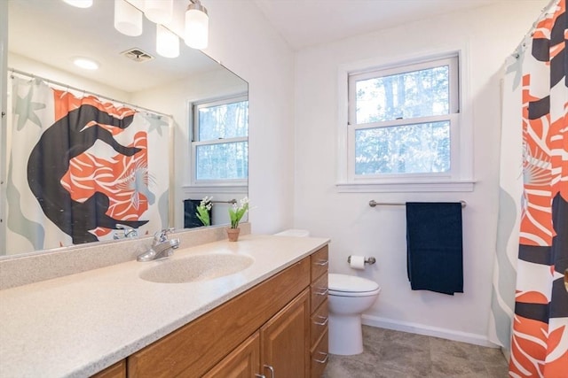 bathroom featuring visible vents, toilet, vanity, and baseboards