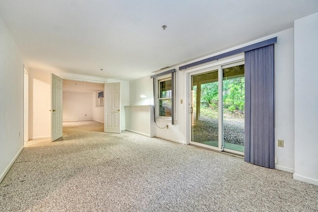 501 Lexington St Unit 105, Waltham, MA 02452 - unfurnished room featuring carpet flooring, baseboards, and fire sprinkler in ceiling