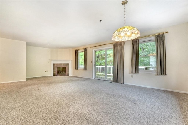 501 Lexington St Unit 105, Waltham, MA 02452 - unfurnished living room featuring baseboards, carpet floors, and a tile fireplace