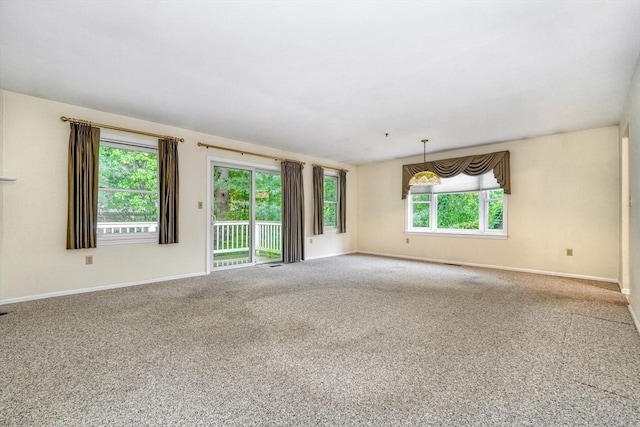 501 Lexington St Unit 105, Waltham, MA 02452 - carpeted empty room featuring baseboards
