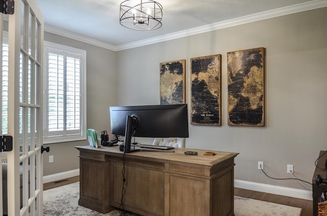 office space featuring crown molding, hardwood / wood-style floors, and a chandelier