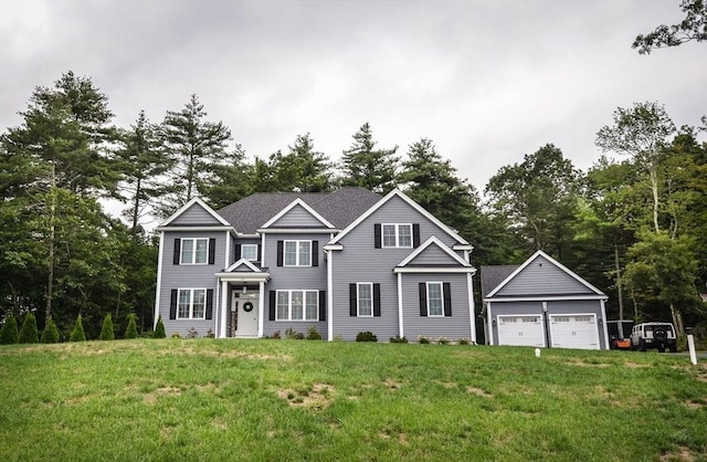 view of front of house featuring a front yard and a garage