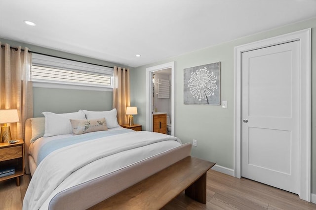 bedroom with recessed lighting, light wood finished floors, and baseboards