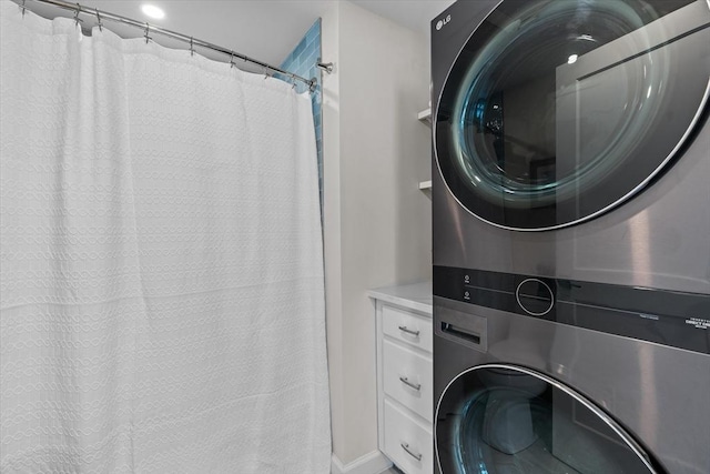 laundry area with stacked washer / dryer