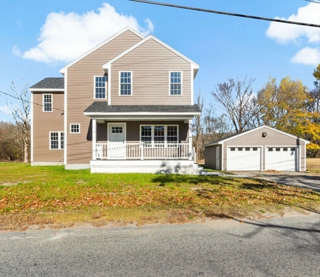 view of property with a garage, covered porch, and an outdoor structure