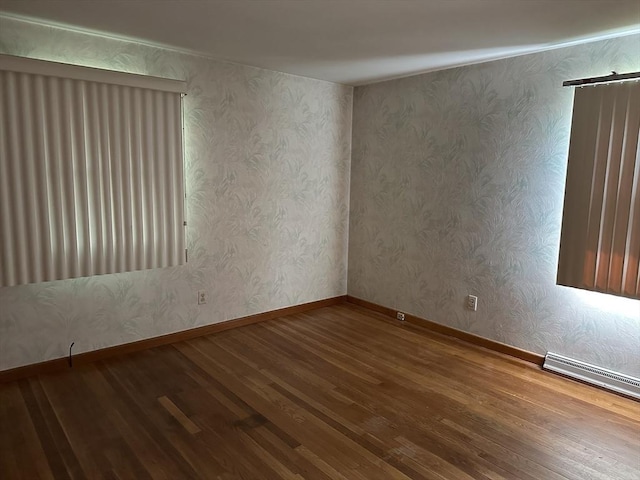 47 Mayfair St, East Longmeadow, MA 01028 - spare room featuring wood finished floors and baseboard heating