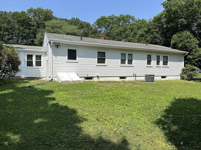 47 Mayfair St, East Longmeadow, MA 01028 - rear view of property featuring a lawn and a chimney