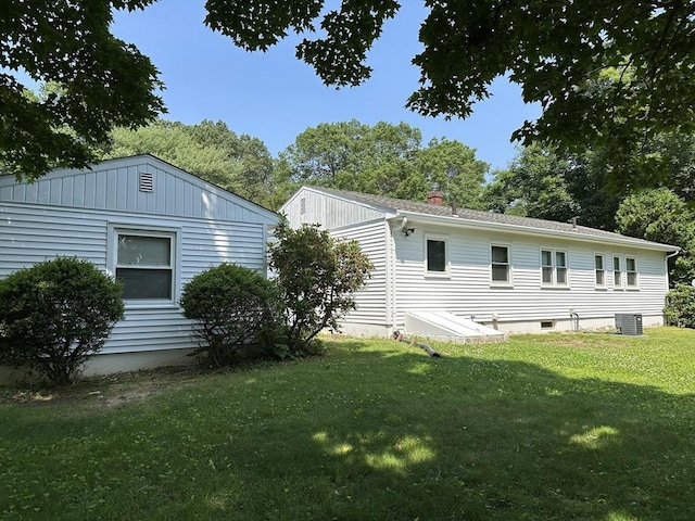 47 Mayfair St, East Longmeadow, MA 01028 - back of house featuring a lawn and a chimney