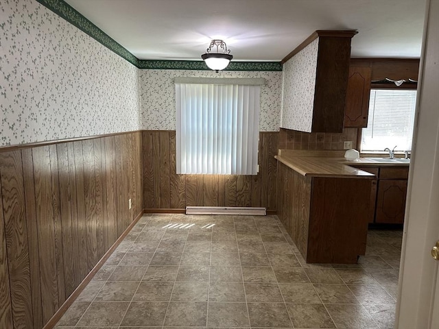 47 Mayfair St, East Longmeadow, MA 01028 - kitchen featuring a wainscoted wall, a baseboard radiator, wallpapered walls, and wooden walls