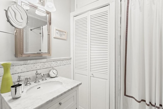 bathroom featuring vanity and wainscoting