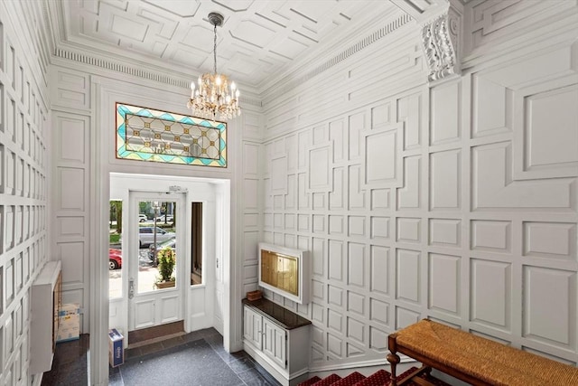 mudroom with a chandelier, crown molding, and a decorative wall