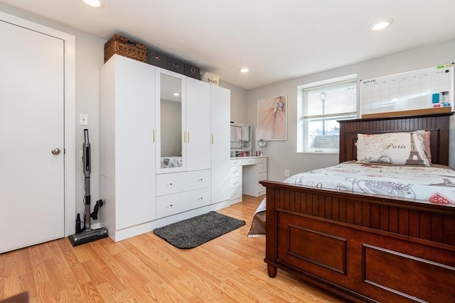 bedroom with light hardwood / wood-style flooring