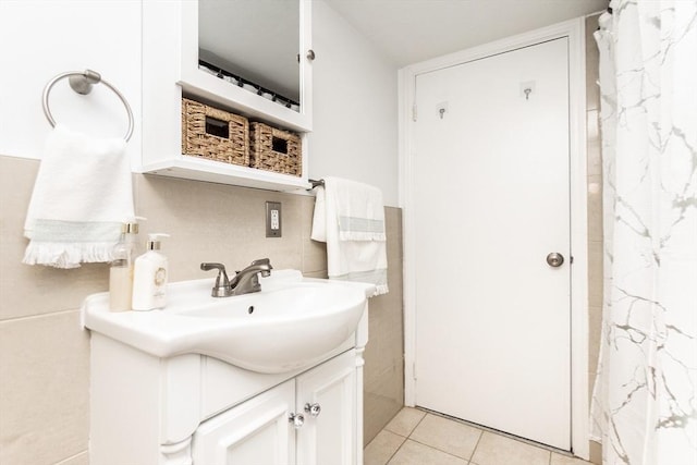 bathroom with tile patterned flooring and vanity