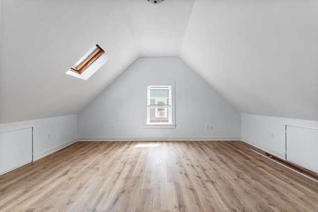 61 Elm St Unit 61, Andover, MA 01810 - additional living space with a skylight, lofted ceiling, and wood finished floors