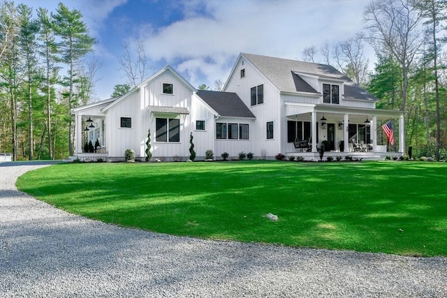 30 Indian Cove Rd, Marion, MA 02738 - modern farmhouse style home with covered porch, a front lawn, board and batten siding, driveway, and roof with shingles
