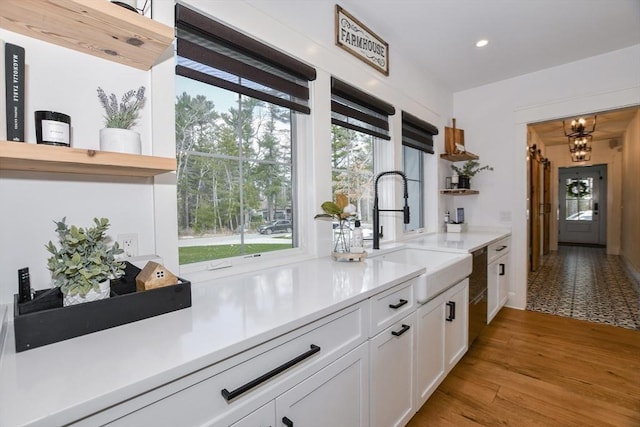 30 Indian Cove Rd, Marion, MA 02738 - kitchen with open shelves, a sink, white cabinetry, light countertops, and recessed lighting