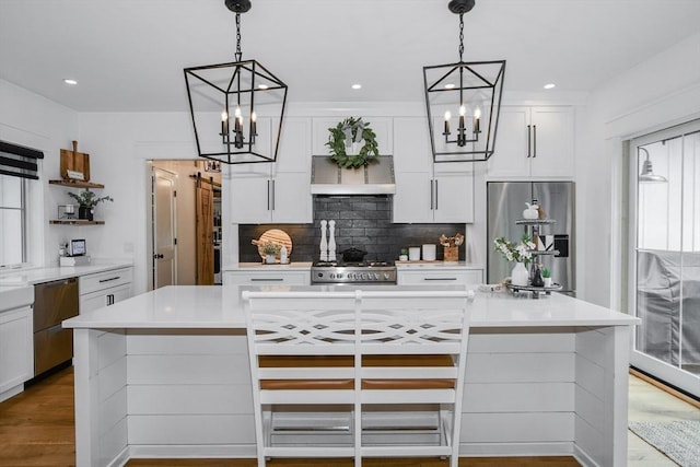 30 Indian Cove Rd, Marion, MA 02738 - kitchen with appliances with stainless steel finishes, a chandelier, open shelves, backsplash, and white cabinets